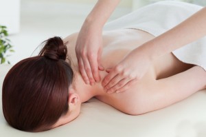 Red-haired woman having a rolling massage